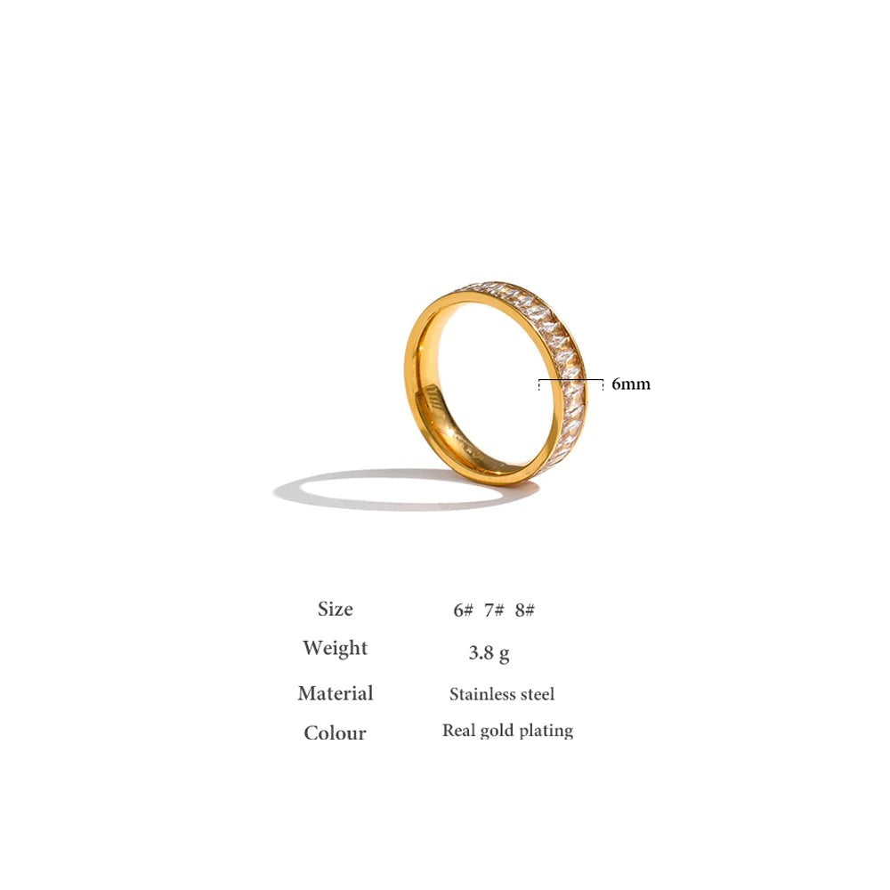 Cubic zirconia geometric ring in 18K gold-plated stainless steel with cubic zirconia.