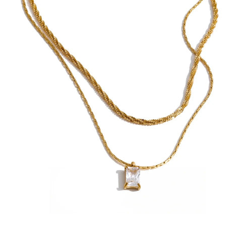 Gold-plated stainless steel necklace with cubic zirconia pendant.