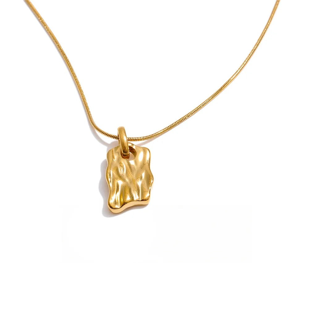 Gold-plated stainless steel necklace featuring a small, simple pendant shaped like a leaf.