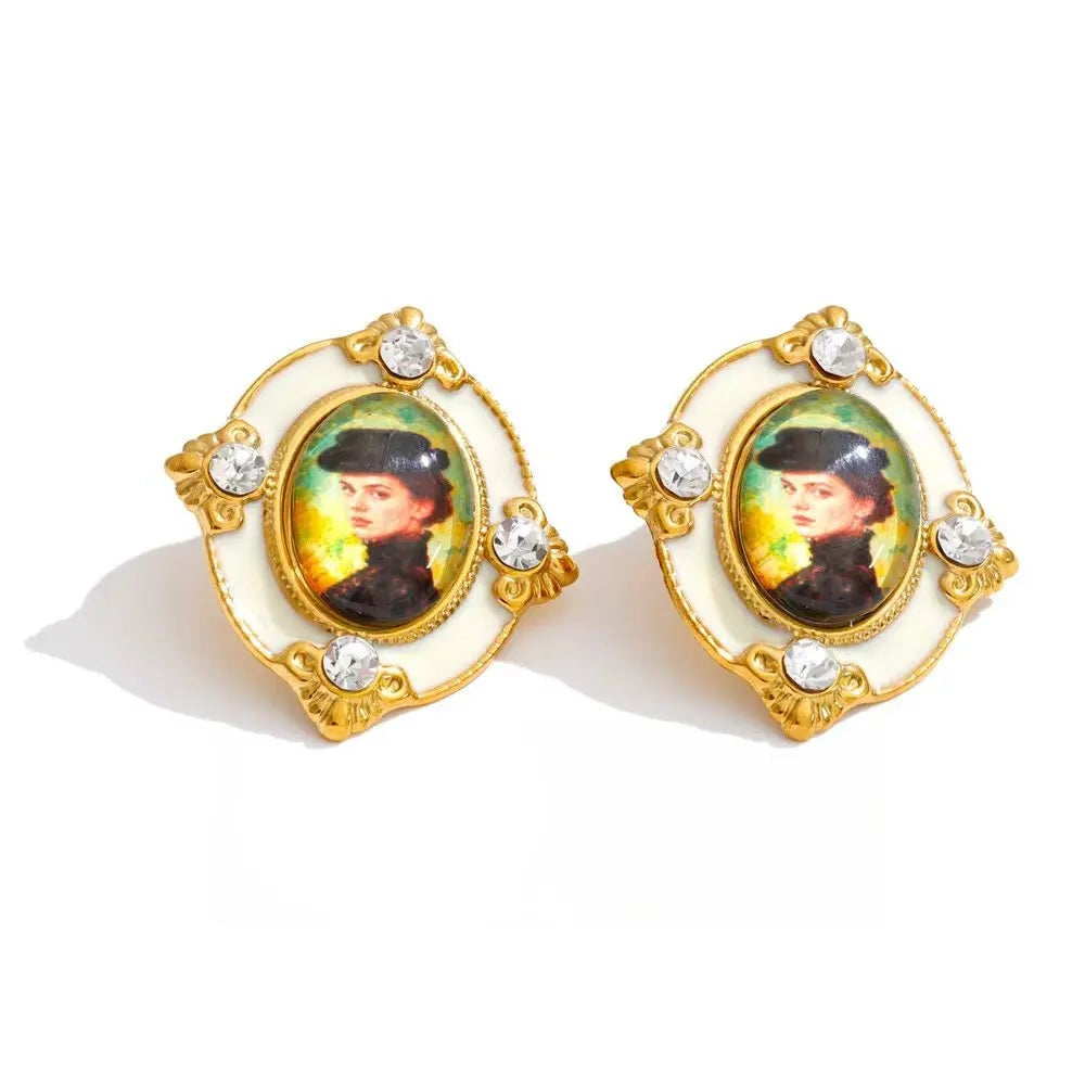 Gold-plated stainless steel earrings with resin and crystal featuring a portrait of a woman.