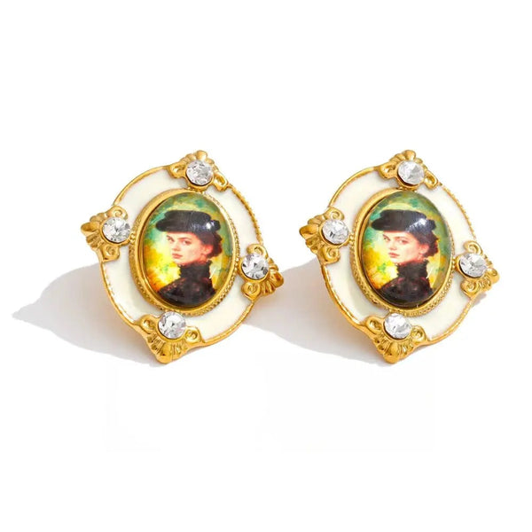 Gold-plated stainless steel earrings with resin and crystal featuring a portrait of a woman.