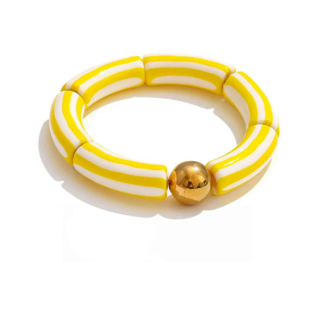 Bracelet made of gold-plated stainless steel with resin and acrylic.