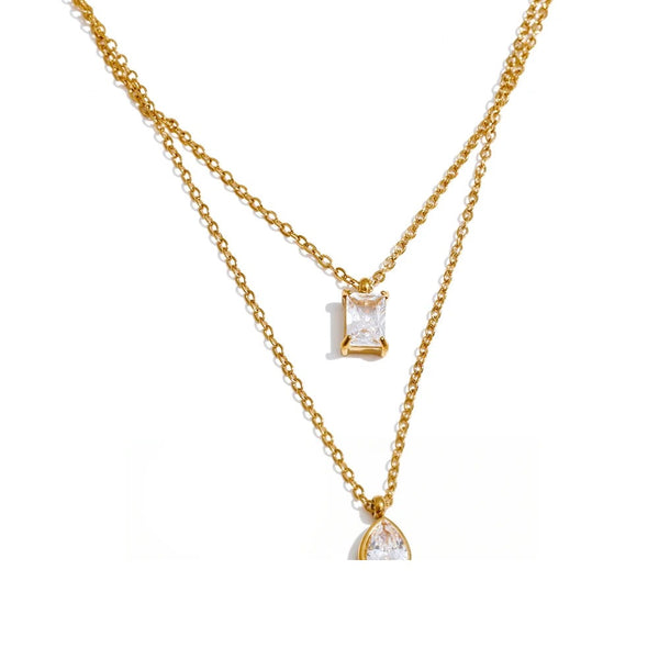 Gold-plated stainless steel necklace with cubic zirconia pendant.