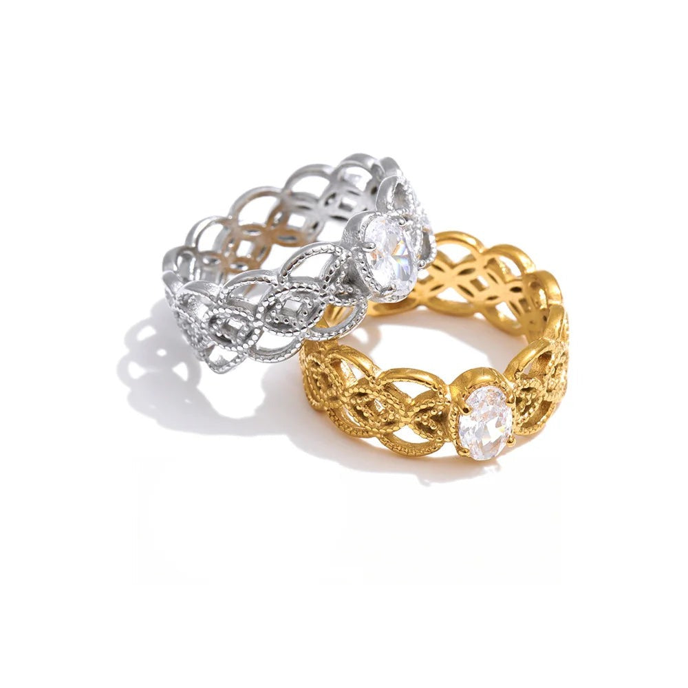Ring set in gold-plated stainless steel with cubic zirconia stones.