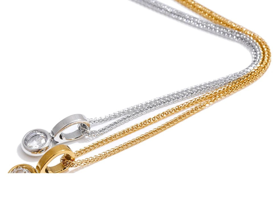 Cubic zirconia geometric necklace in gold-plated stainless steel with cubic zirconia.