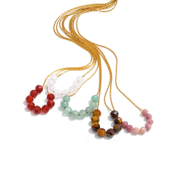 Gold-plated necklace with natural stone beads in shades of blue, green, brown, and red.