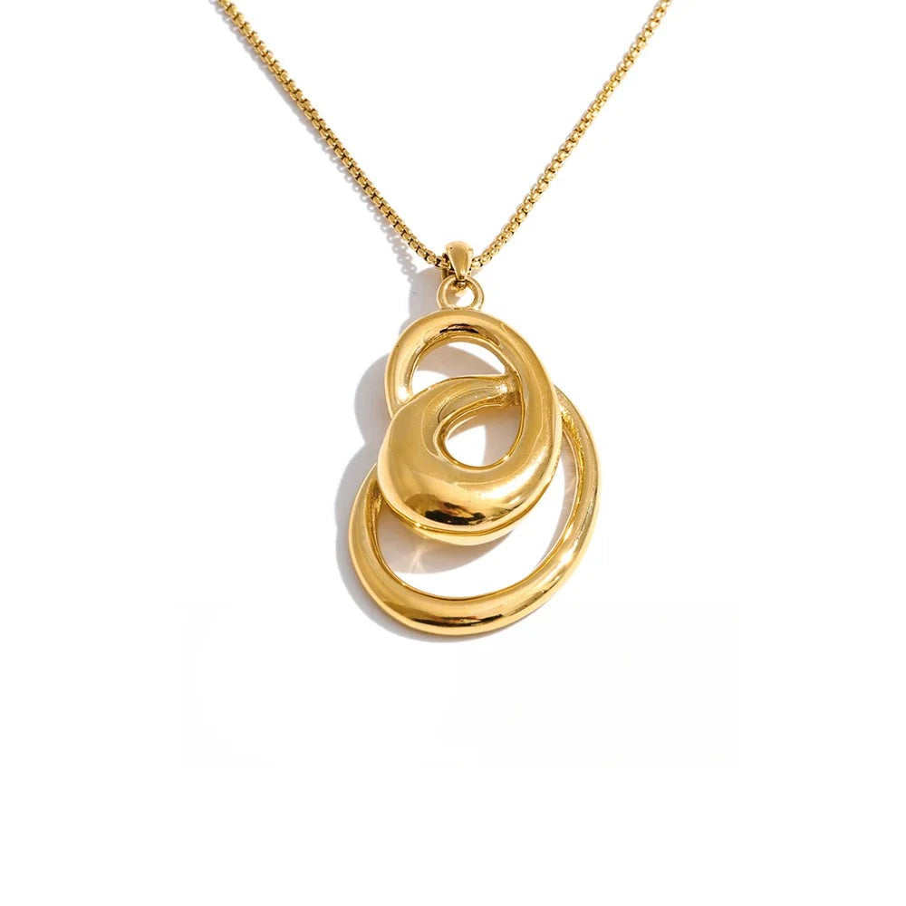 Gold-plated stainless steel necklace featuring a large, intricate circular design.