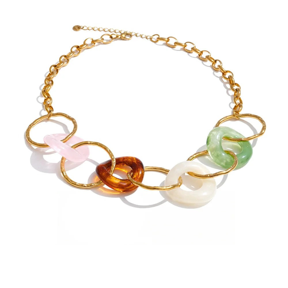 Gold-plated stainless steel necklace with resin and acrylic beads in a chain design, featuring a large, colorful focal piece.