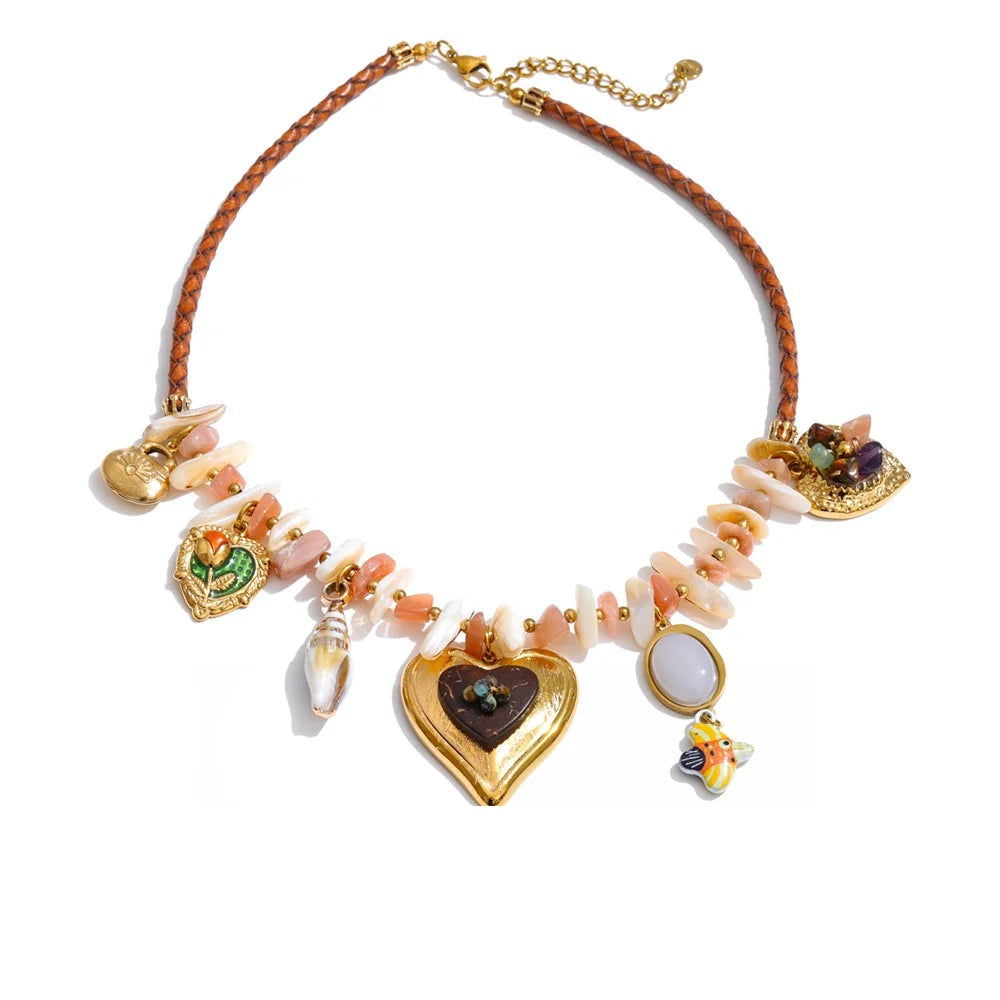 Gold-plated necklace with shells and a heart pendant.