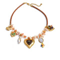 Gold-plated necklace with shells and a heart pendant.