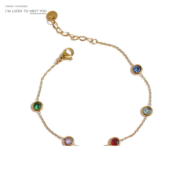 Gold-plated bracelet with multiple colored stones.