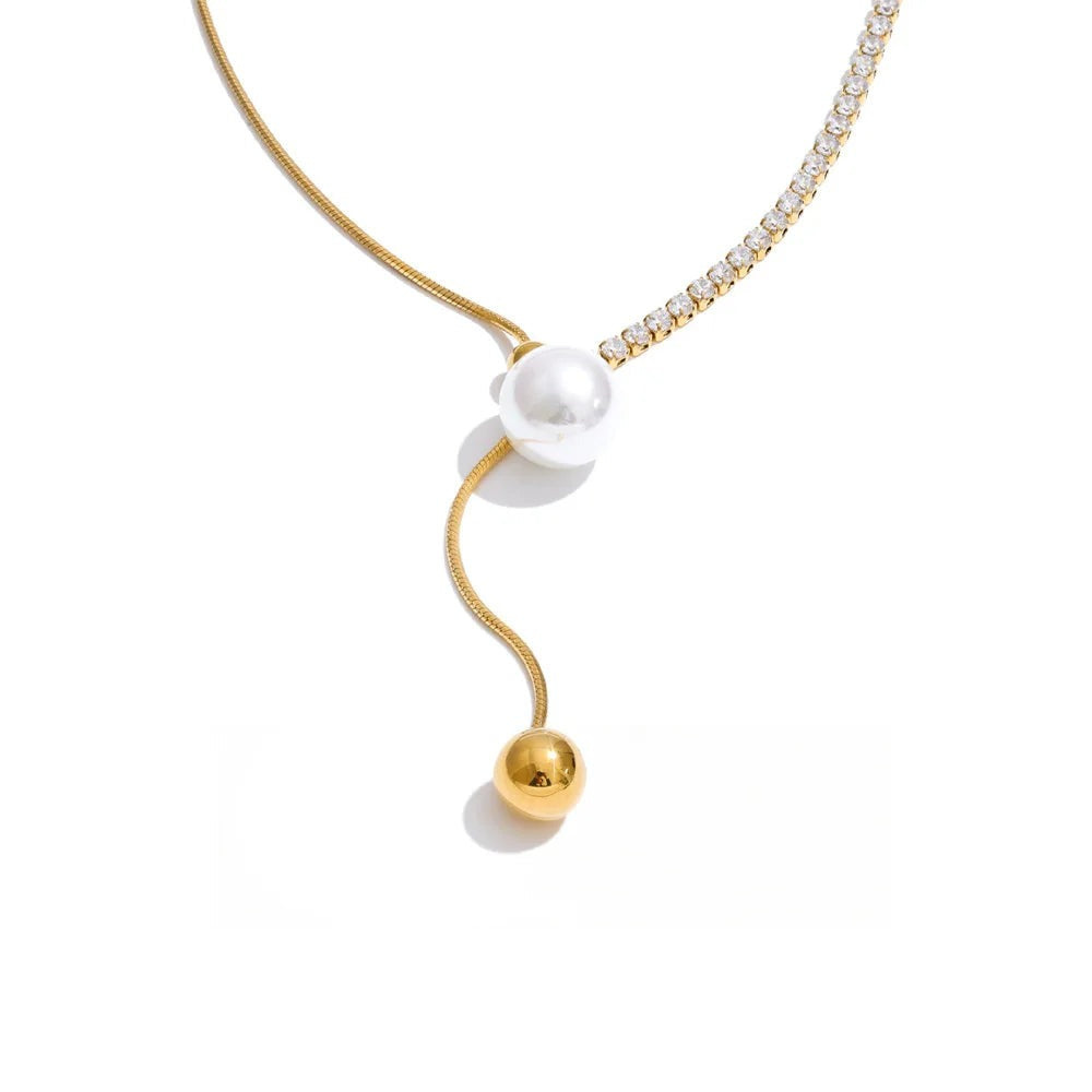 Gold-plated stainless steel necklace with pearl and cubic zirconia.