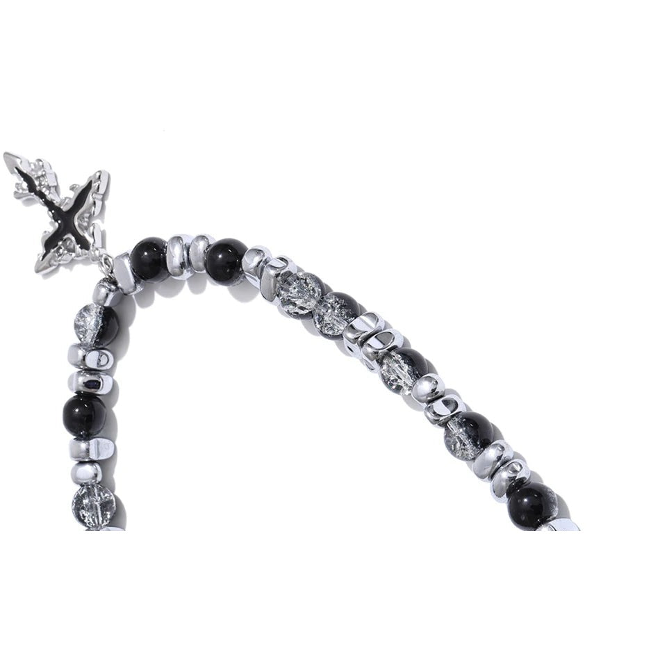 Natural stone cross beaded necklace in gold-plated stainless steel with natural stone.