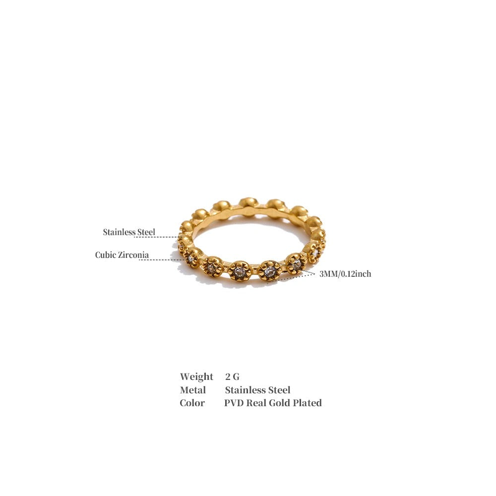 Cubic zirconia flower geometric ring in 18K gold-plated stainless steel with cubic zirconia.