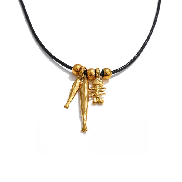 Gold-plated stainless steel necklace featuring a pendant shaped like a woman in a dress with a cross on top.