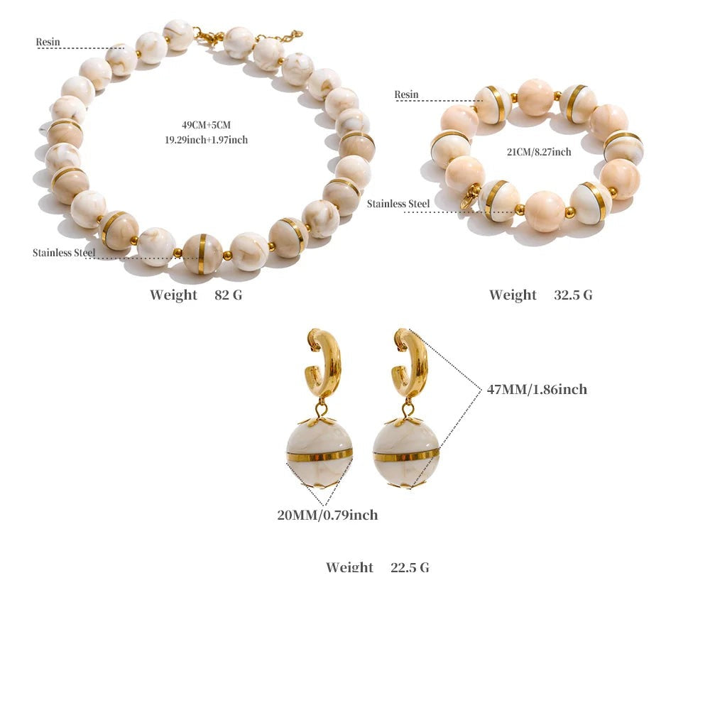 Resin acrylic beaded earrings in gold-plated stainless steel with resin and acrylic.