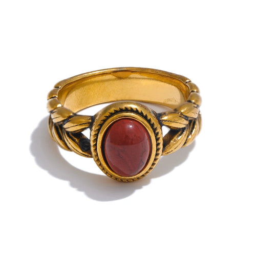 Gold-plated ring with red stone.
