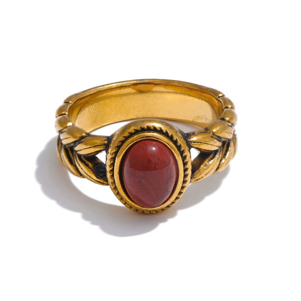 Gold-plated ring with red stone.