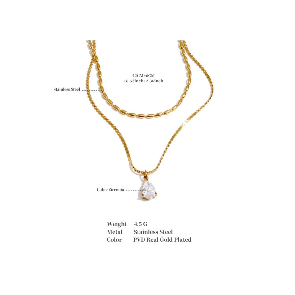 Cubic zirconia geometric layered necklace in gold-plated stainless steel with cubic zirconia.