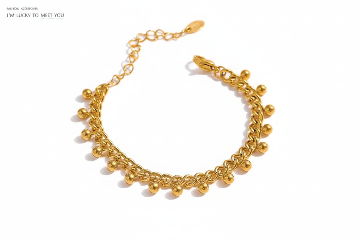 Gold bracelet with beads.