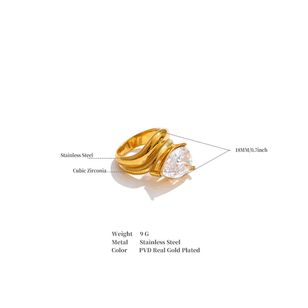Cubic zirconia geometric ring in 18K gold-plated stainless steel with cubic zirconia.