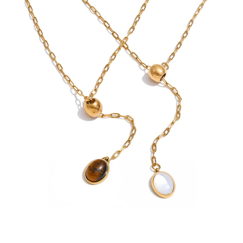 Gold-plated necklace featuring natural stone and shell pendants.