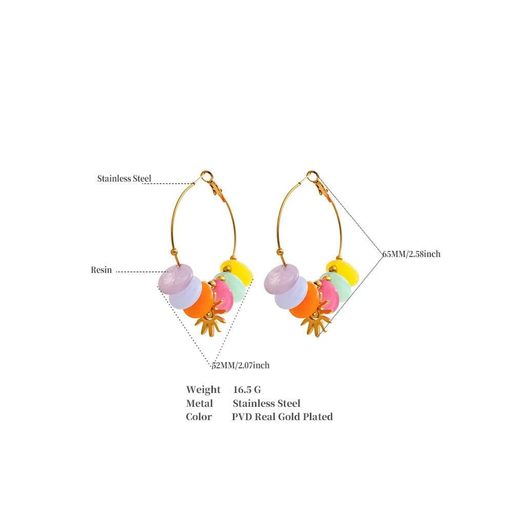 Resin sun geometric earrings in gold-plated stainless steel with resin.