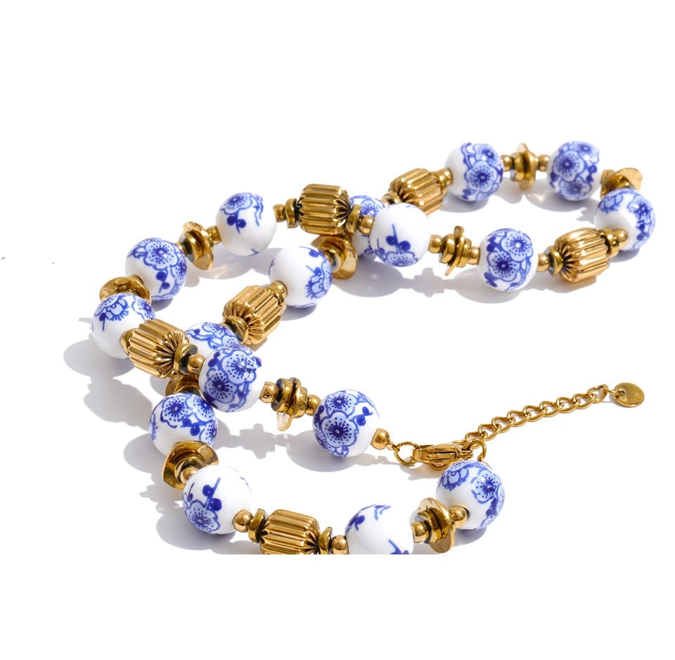 Blue flower beaded necklace in gold-plated stainless steel.