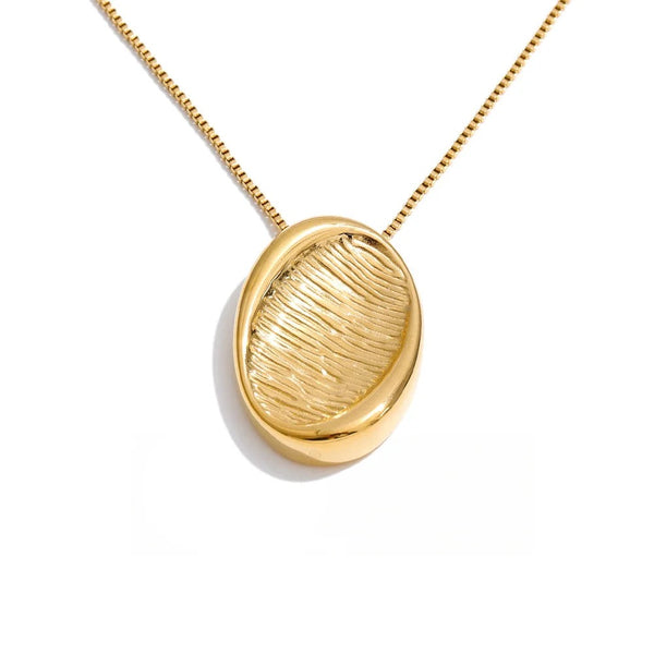 Gold-plated stainless steel necklace with a leaf-shaped pendant.