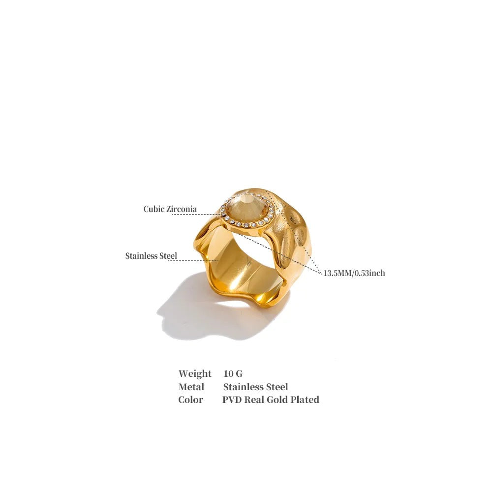 Cubic zirconia geometric ring in 18K gold-plated stainless steel with cubic zirconia.