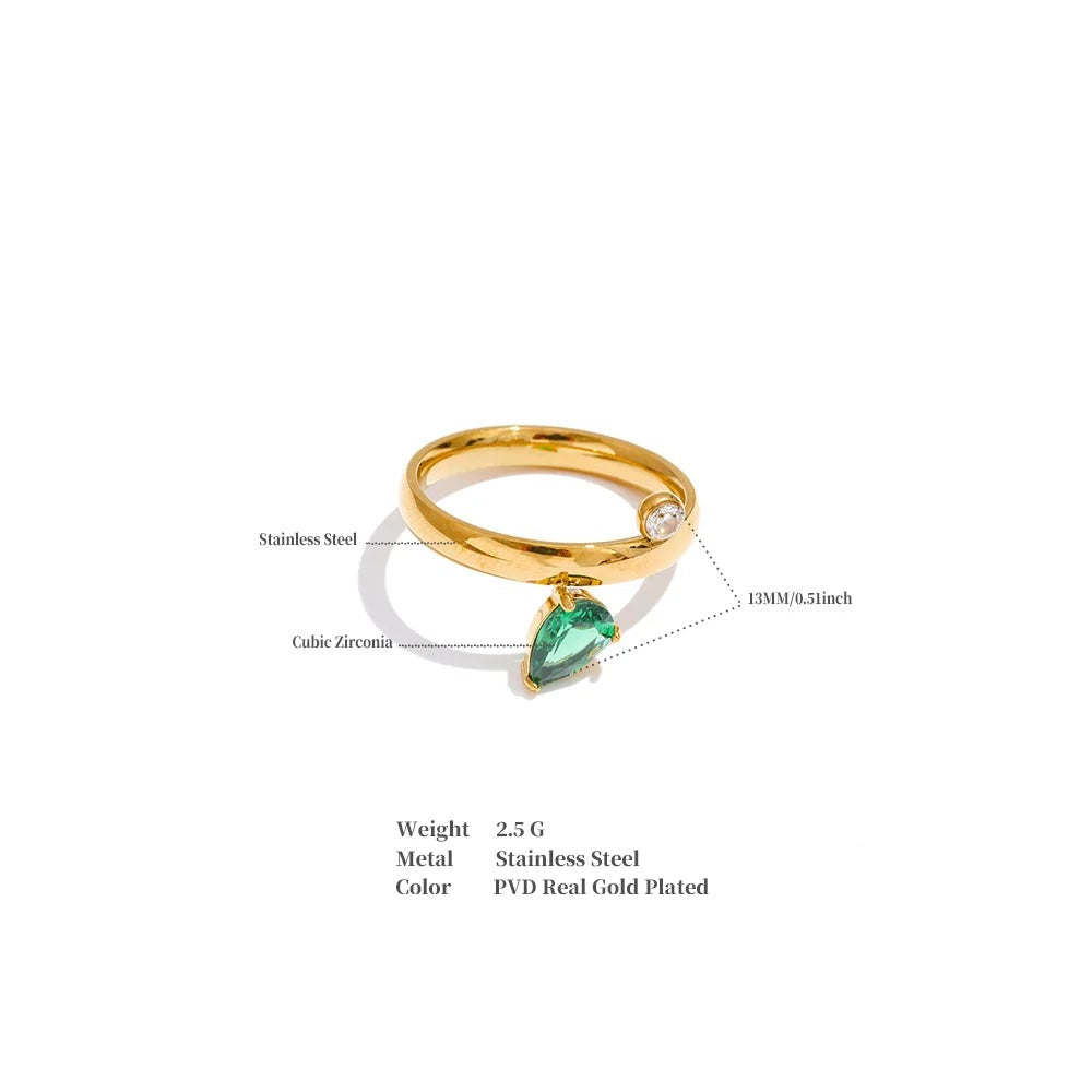 Green cubic zirconia geometric ring in 18K gold-plated stainless steel with cubic zirconia.