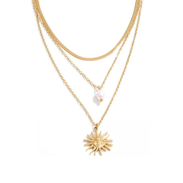 Gold-plated stainless steel necklace with pearl pendant and sun charm.