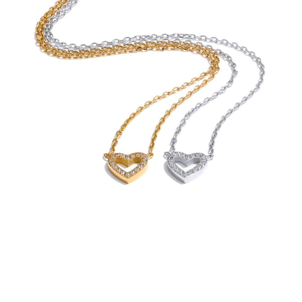 Gold-plated stainless steel necklace with cubic zirconia charms featuring a heart and a diamond shape.