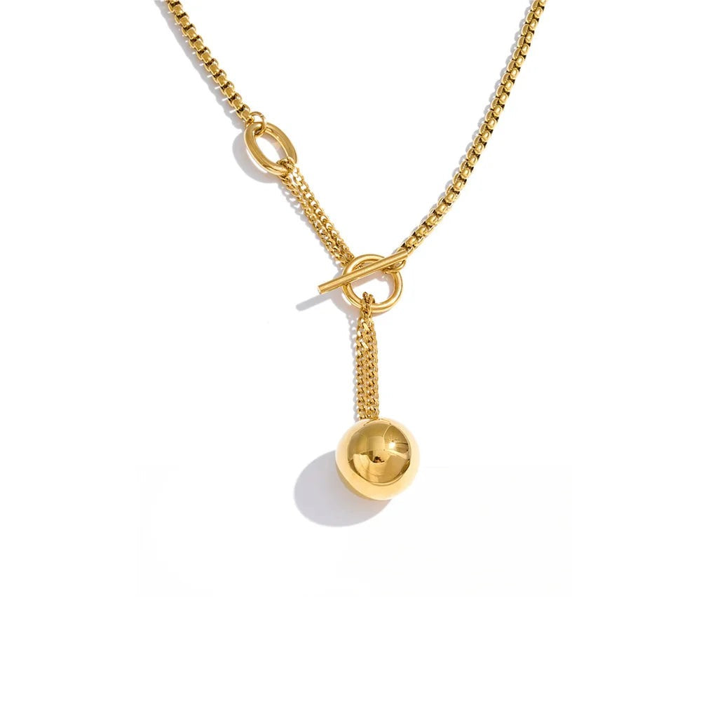 Gold-plated stainless steel necklace with a small pendant.