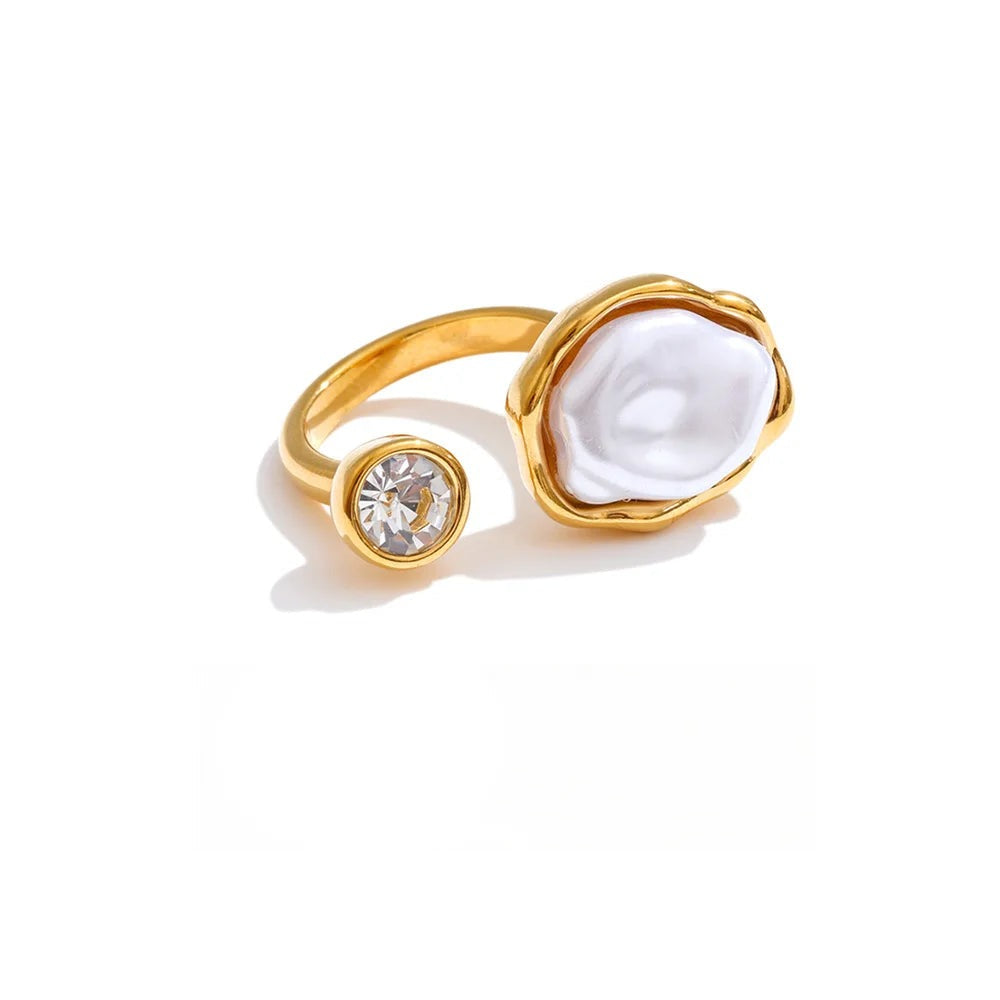 Gold-plated ring with pearl and cubic zirconia.