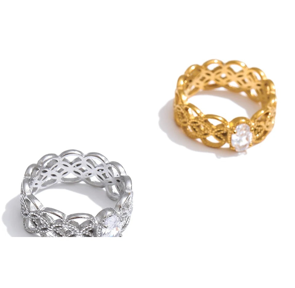 Cubic zirconia geometric ring in 18K gold-plated stainless steel with cubic zirconia.