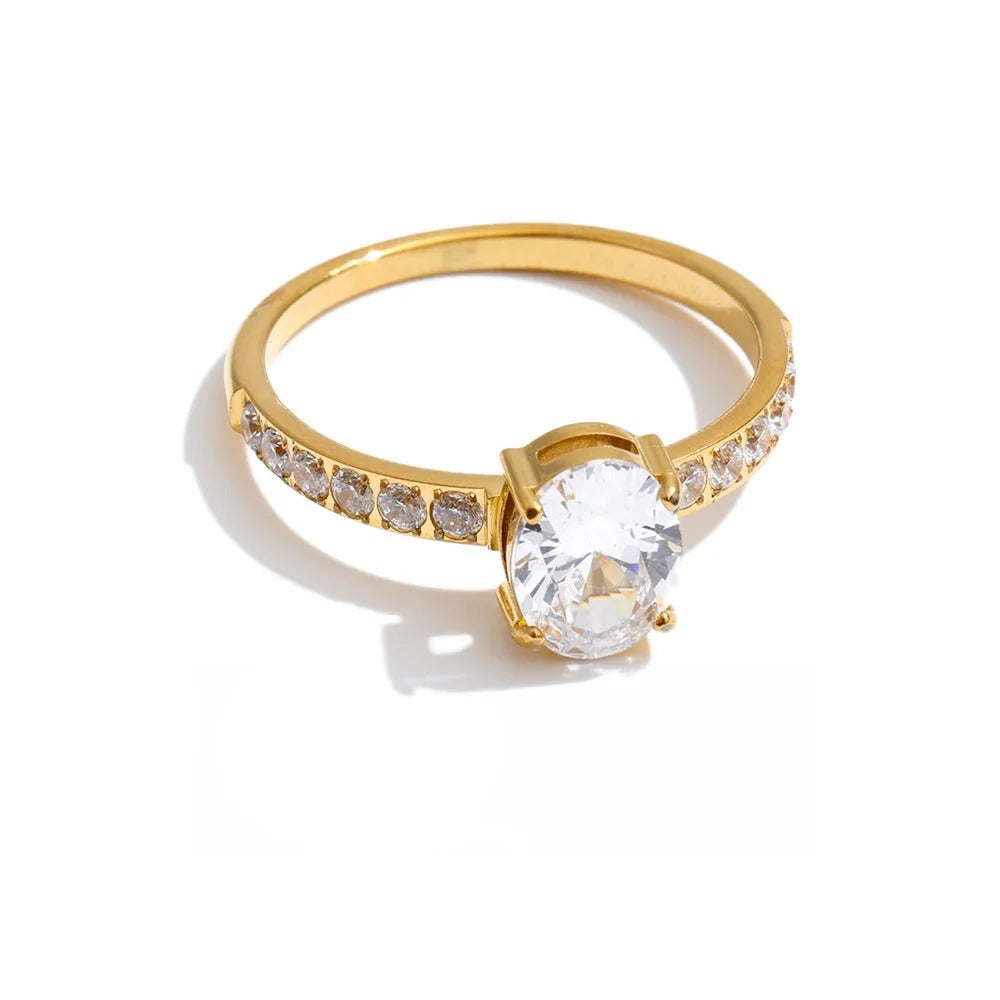 Gold-plated ring with cubic zirconia set in a halo around the central stone.