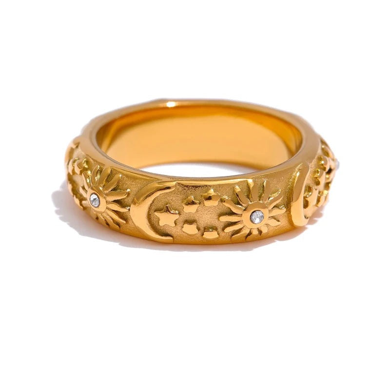 Gold-plated ring with a sun design.