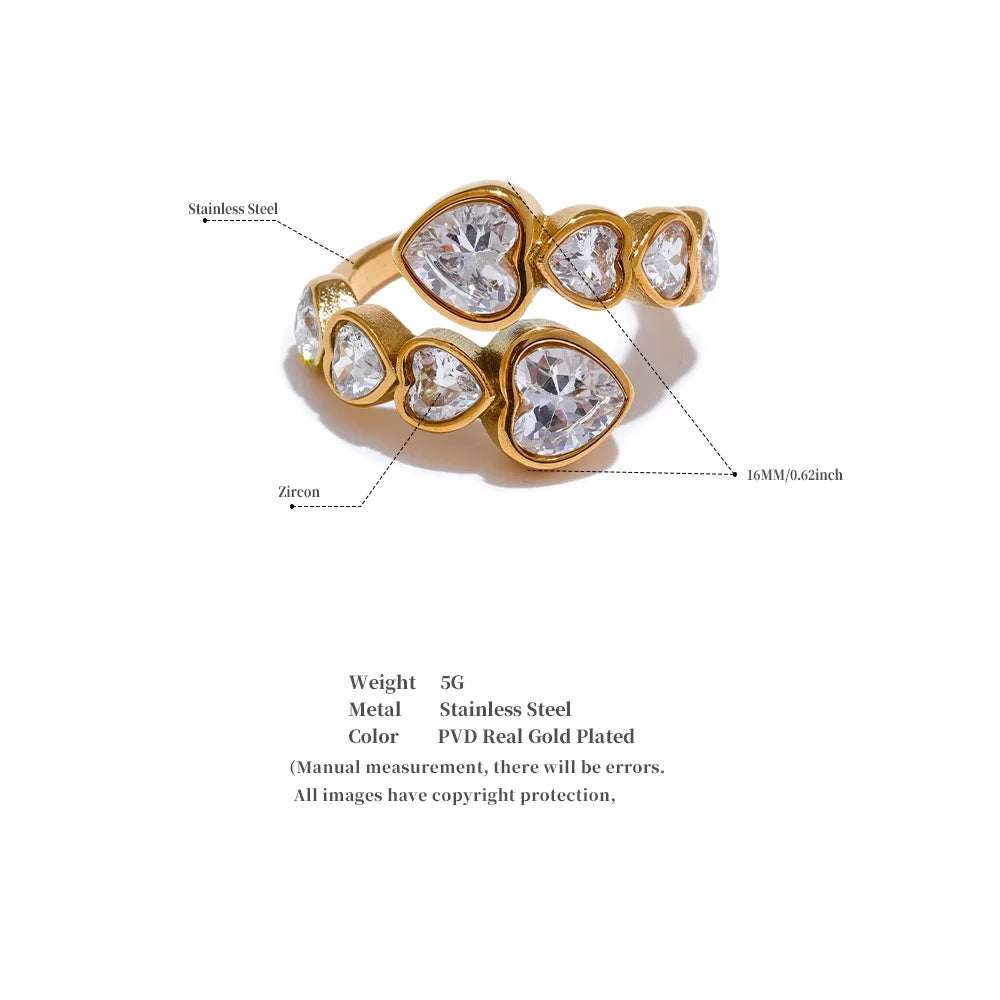 Cubic zirconia heart ring in 18K gold-plated stainless steel with cubic zirconia.
