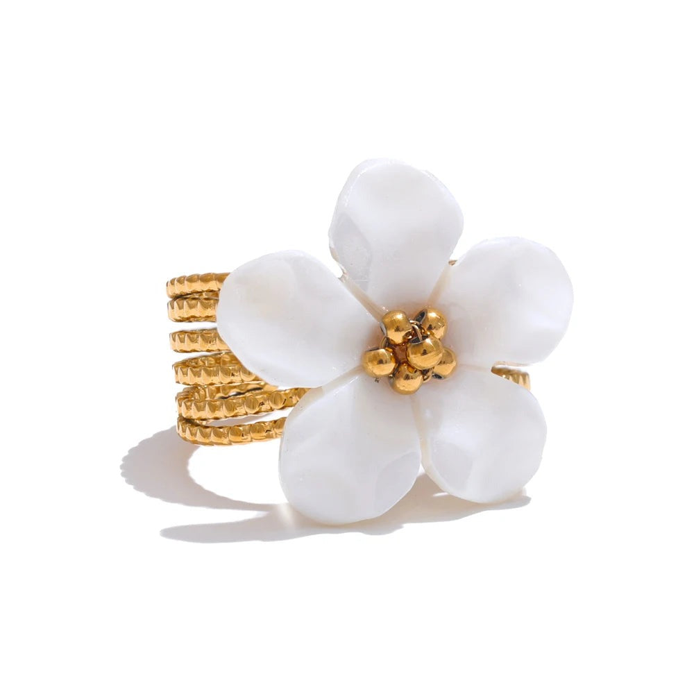 Gold-plated stainless steel ring with white flower.