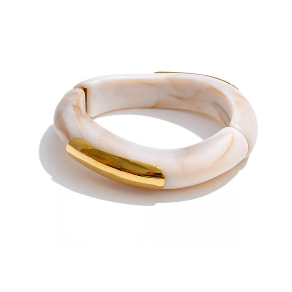 Gold-plated stainless steel bracelet with resin and acrylic.