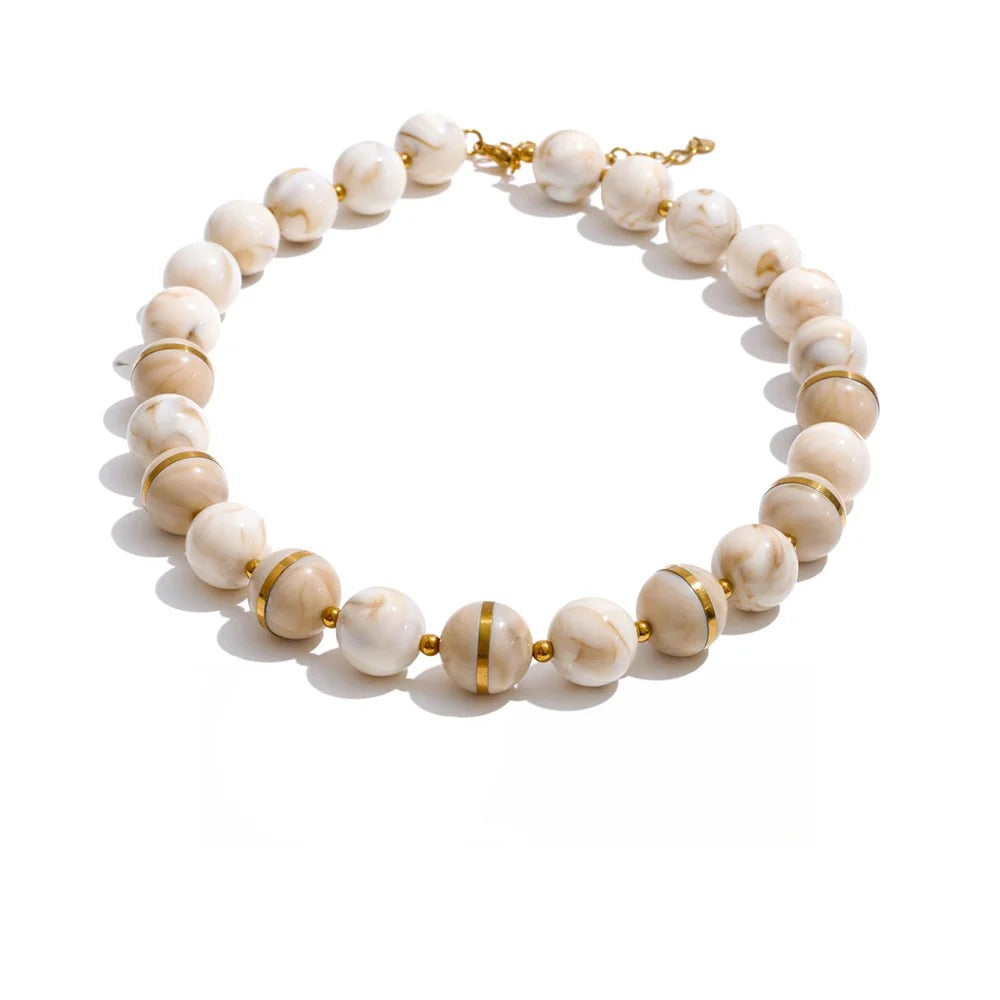 Gold-plated stainless steel earrings with white marble beads.