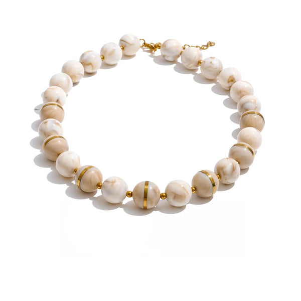 Gold-plated stainless steel earrings with white marble beads.