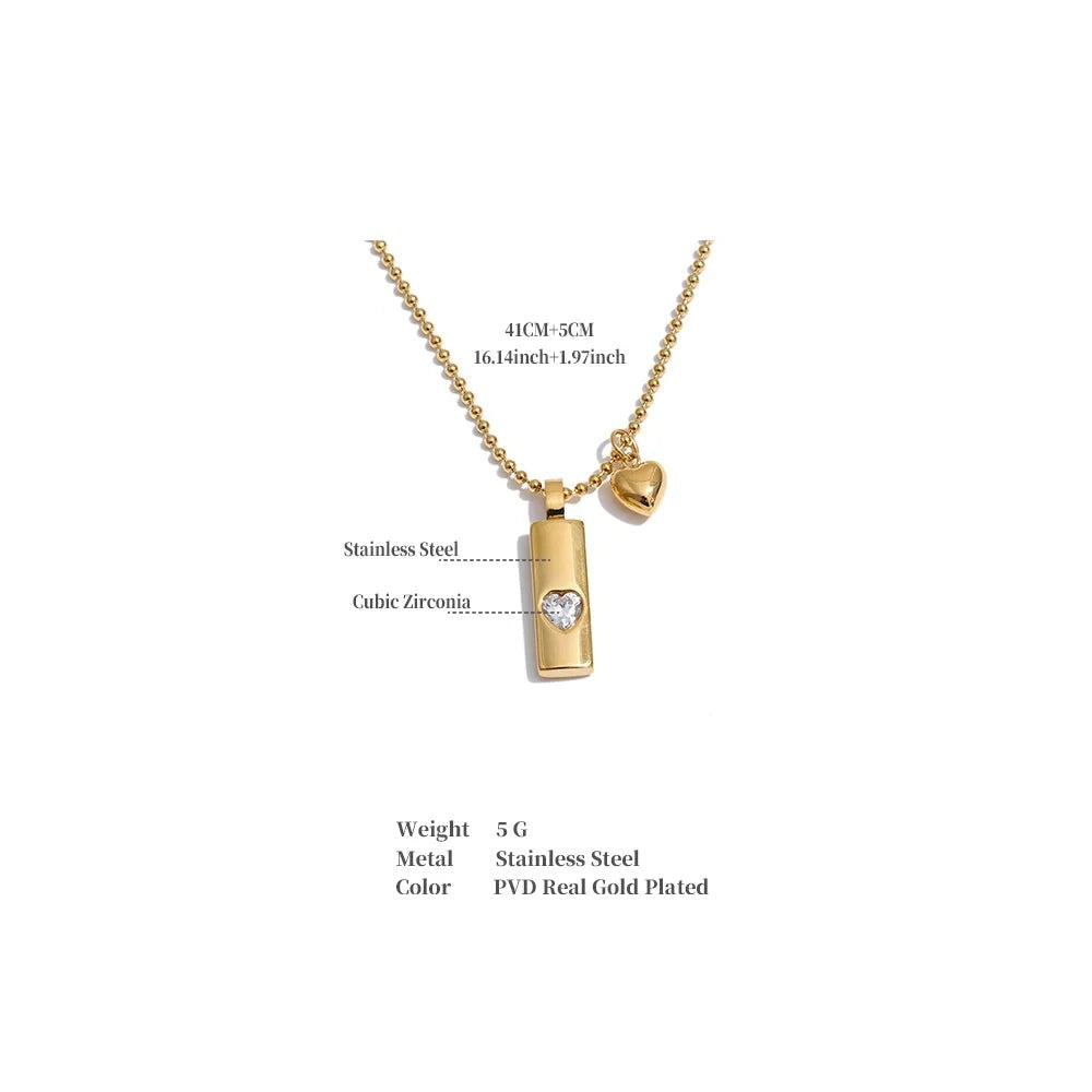 Cubic zirconia heart geometric necklace in gold-plated stainless steel with cubic zirconia.