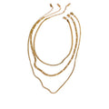 Gold-plated stainless steel necklace with multiple chains.