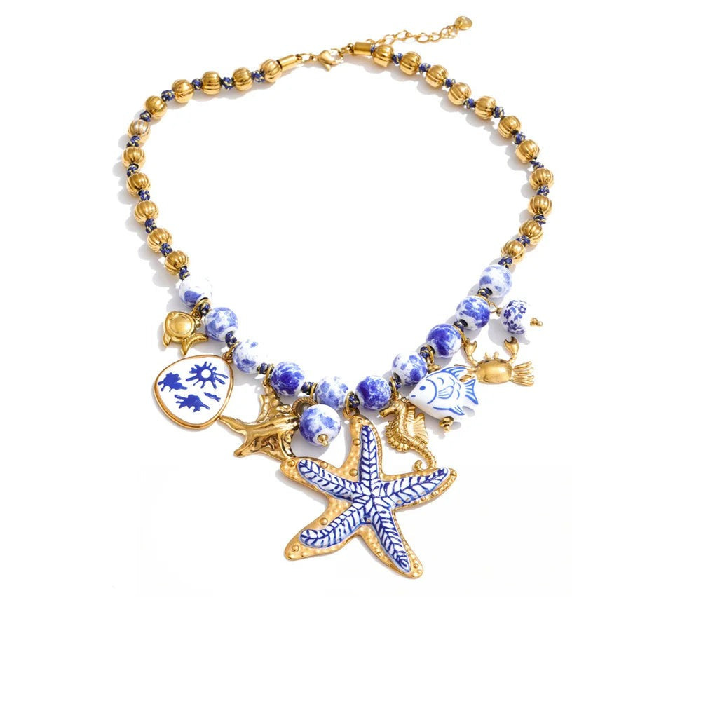 Gold-plated stainless steel necklace with a blue starfish pendant.