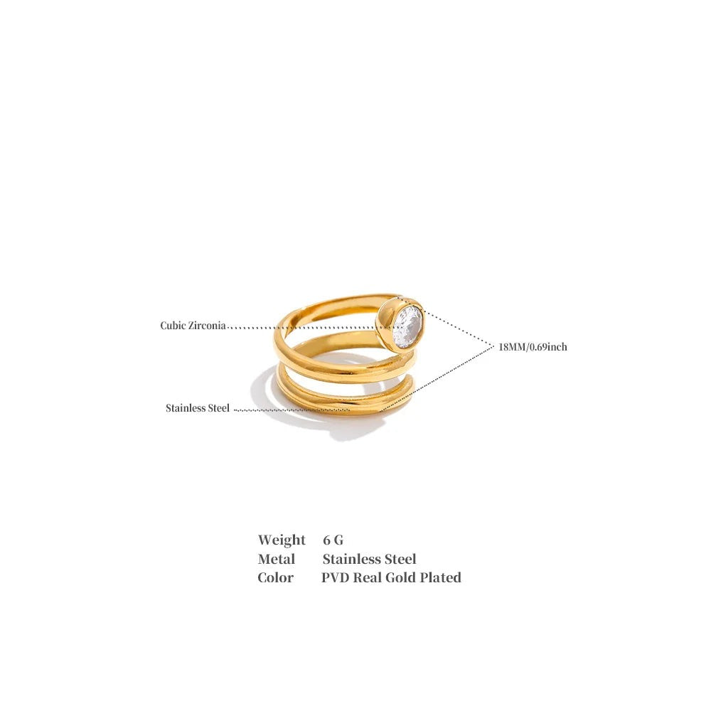Cubic zirconia geometric layered ring in 18K gold-plated stainless steel with cubic zirconia.