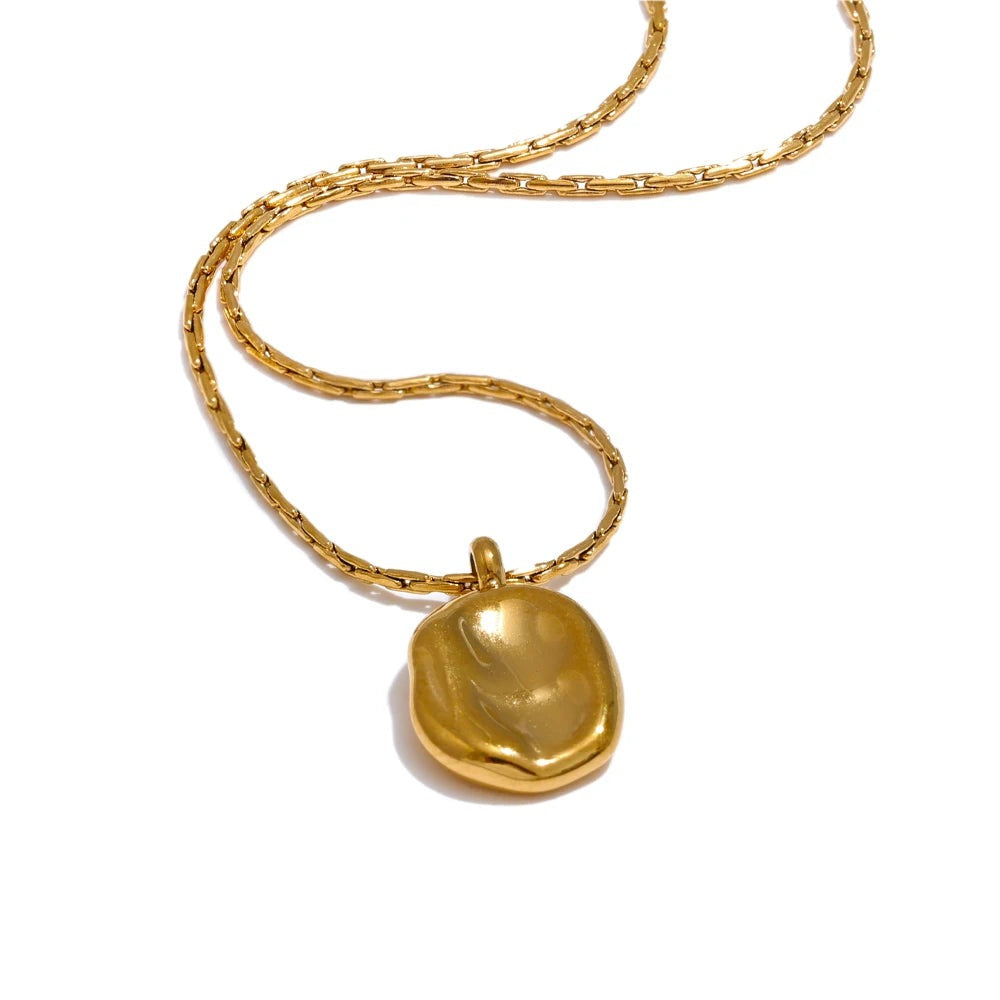 Gold-plated stainless steel necklace with a small pendant.