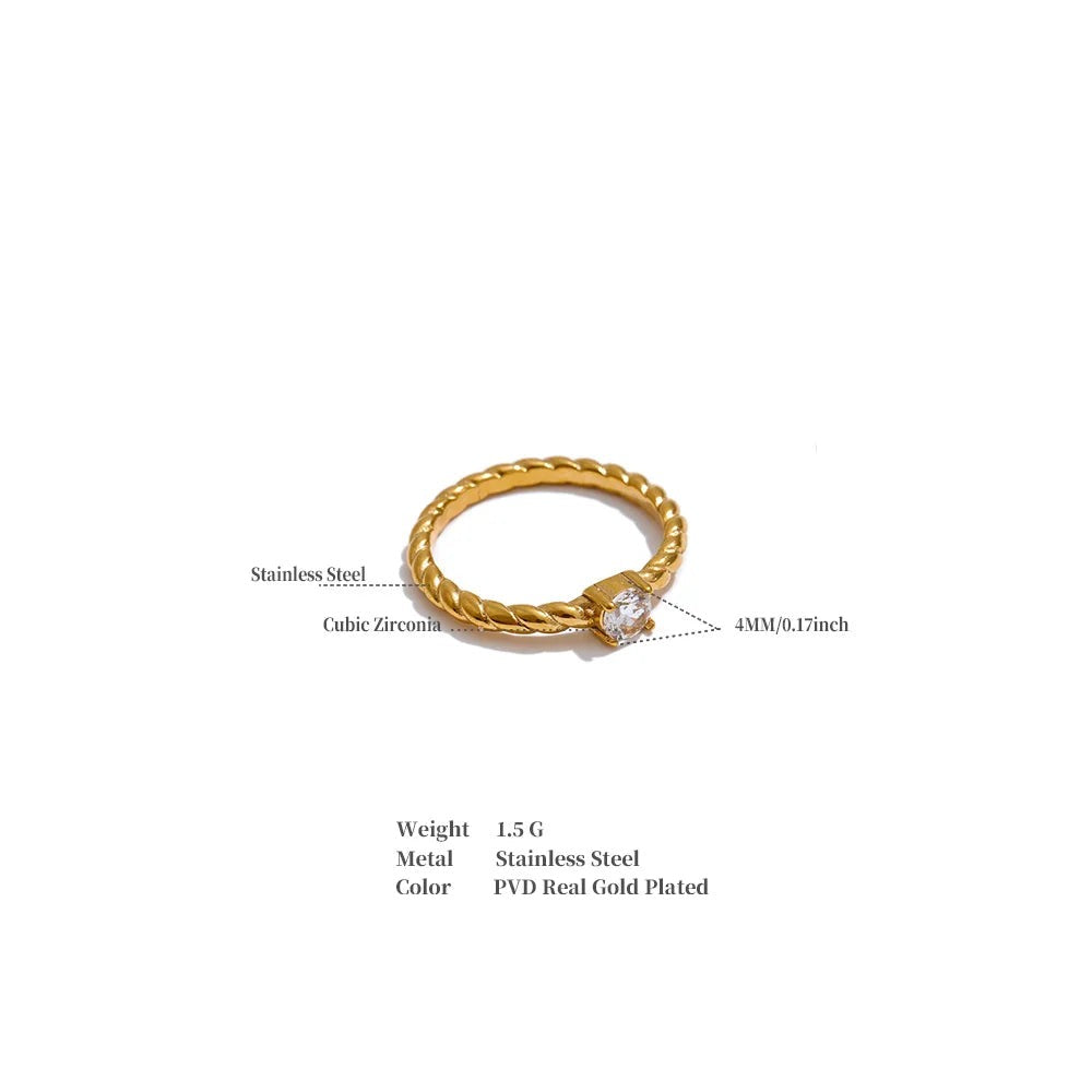 Cubic zirconia geometric ring in 18K gold-plated stainless steel with cubic zirconia.