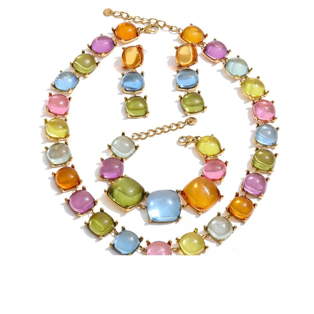Gold-plated stainless steel earrings with resin and acrylic in a variety of colors.